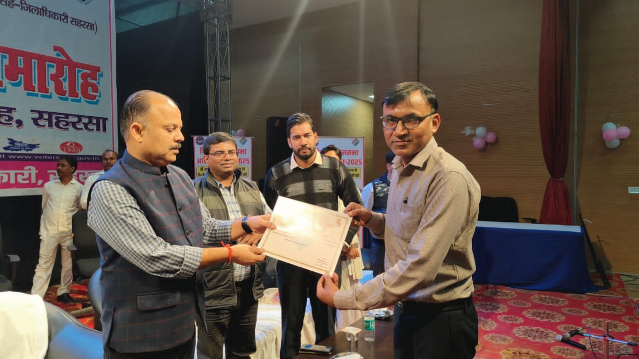 DM gave a certificate of appreciation to the teacher for his excellent work in the assembly elections.