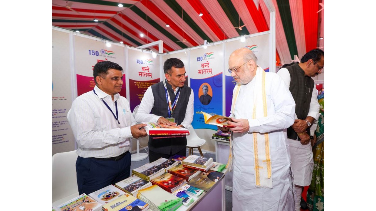 Amit Shah distributed books to children at the Ahmedabad International Book Fair in Ahmedabad.